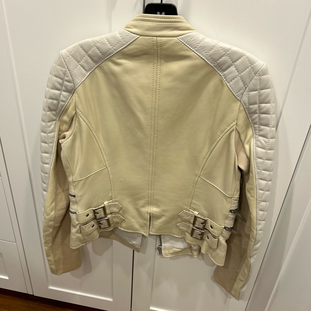 BCBG two-tone leather jacket with quilted detail.